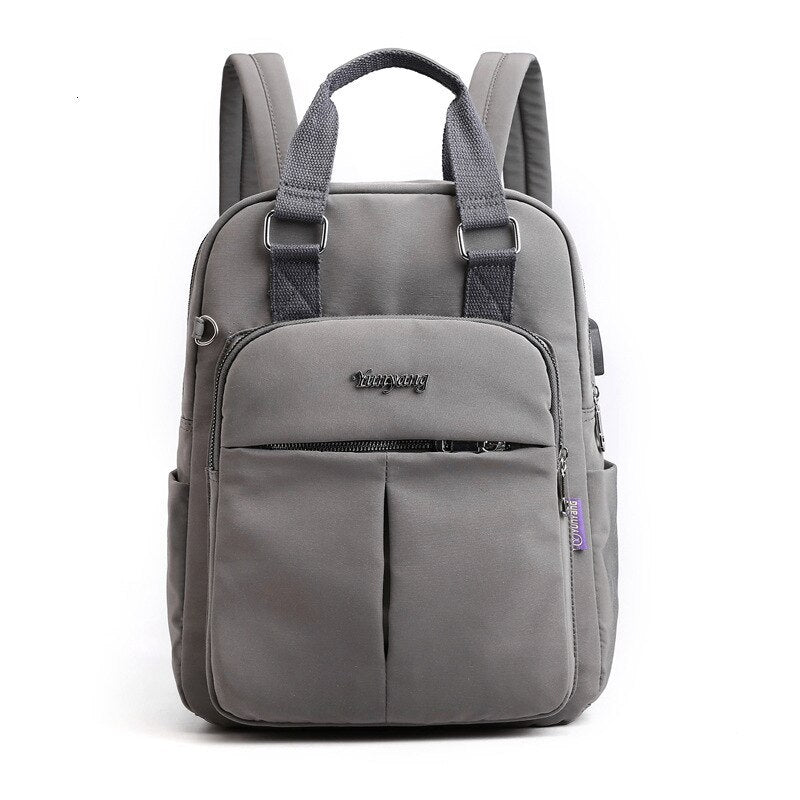 NOUVEAU RICHE Calico | Wasserabweisender USB-Lade-Rucksack mit Diebstahlschutz – Mehrfach-Fach-Design Dunkelgrau