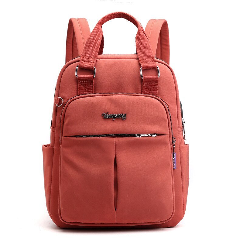 NOUVEAU RICHE Calico | Wasserabweisender USB-Lade-Rucksack mit Diebstahlschutz – Mehrfach-Fach-Design Orange
